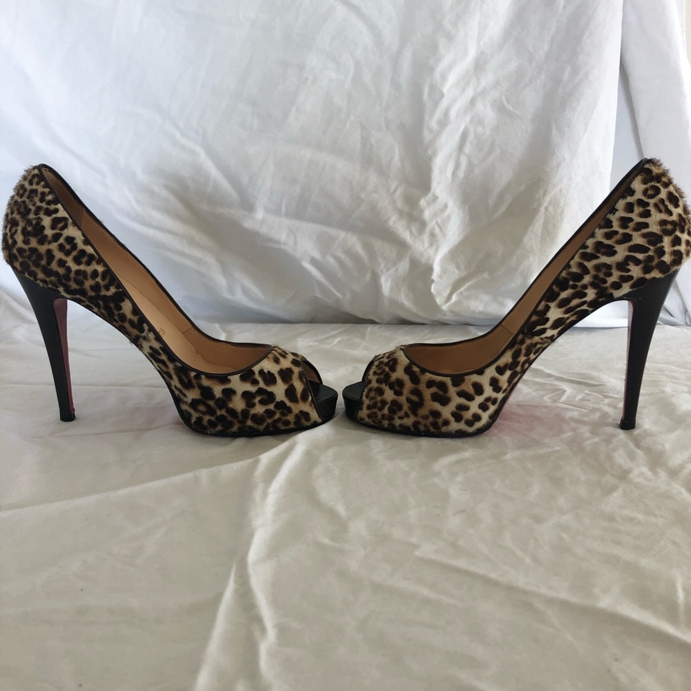 Cheetah print calf hair peep toe pumps